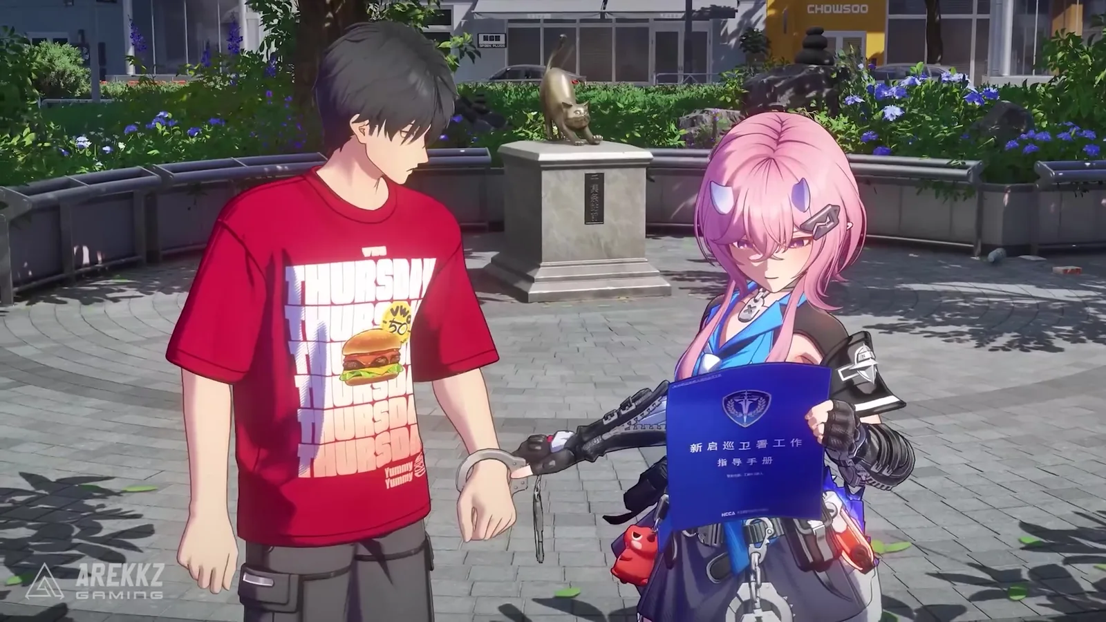 Ananta Richie, the pink-haired cop, handcuffing a man in a red burger T-shirt on a sunny plaza